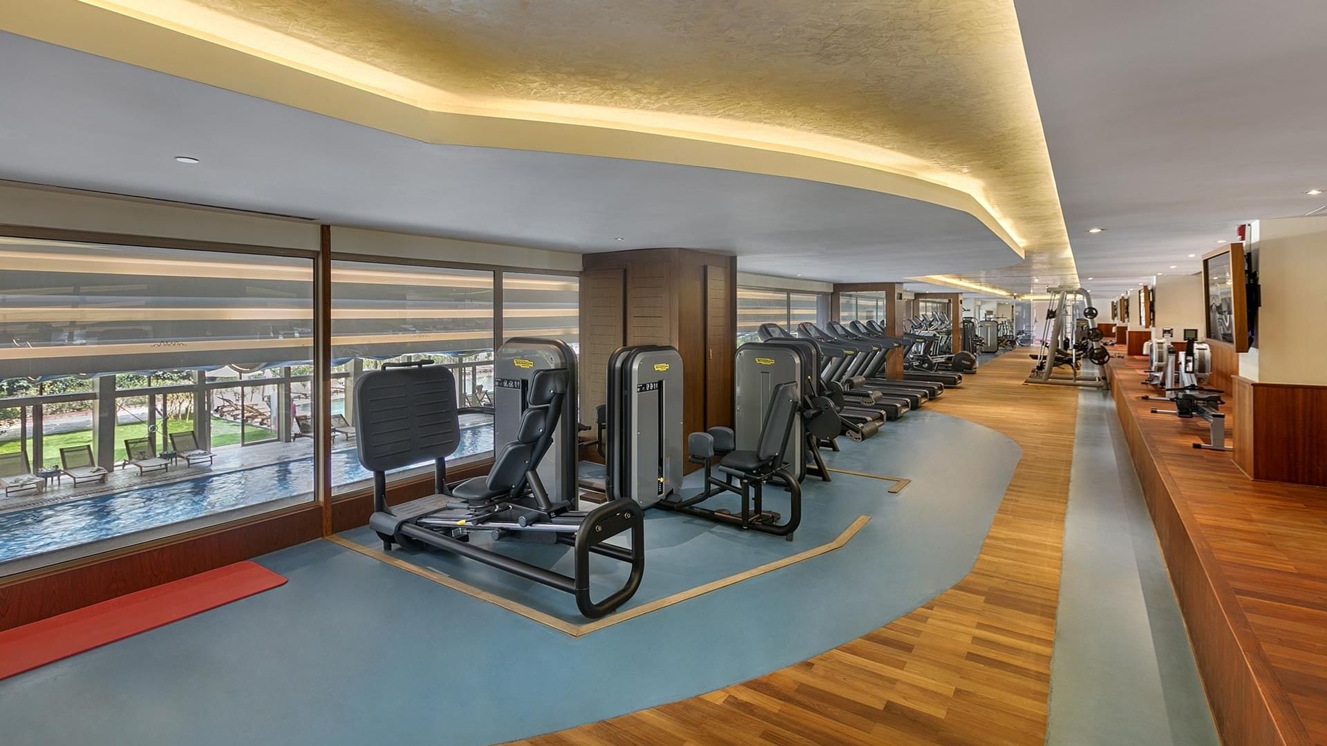 Fitness equipment lined up in a gym at Titanic Mardan Palace