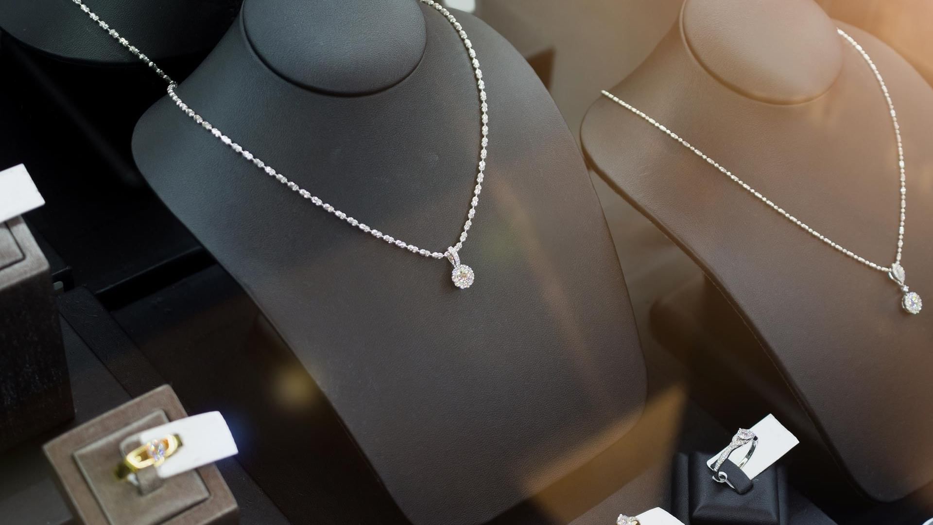 A jewelry display showcasing an elegant diamond necklace in a shop near Titanic Mardan Palace