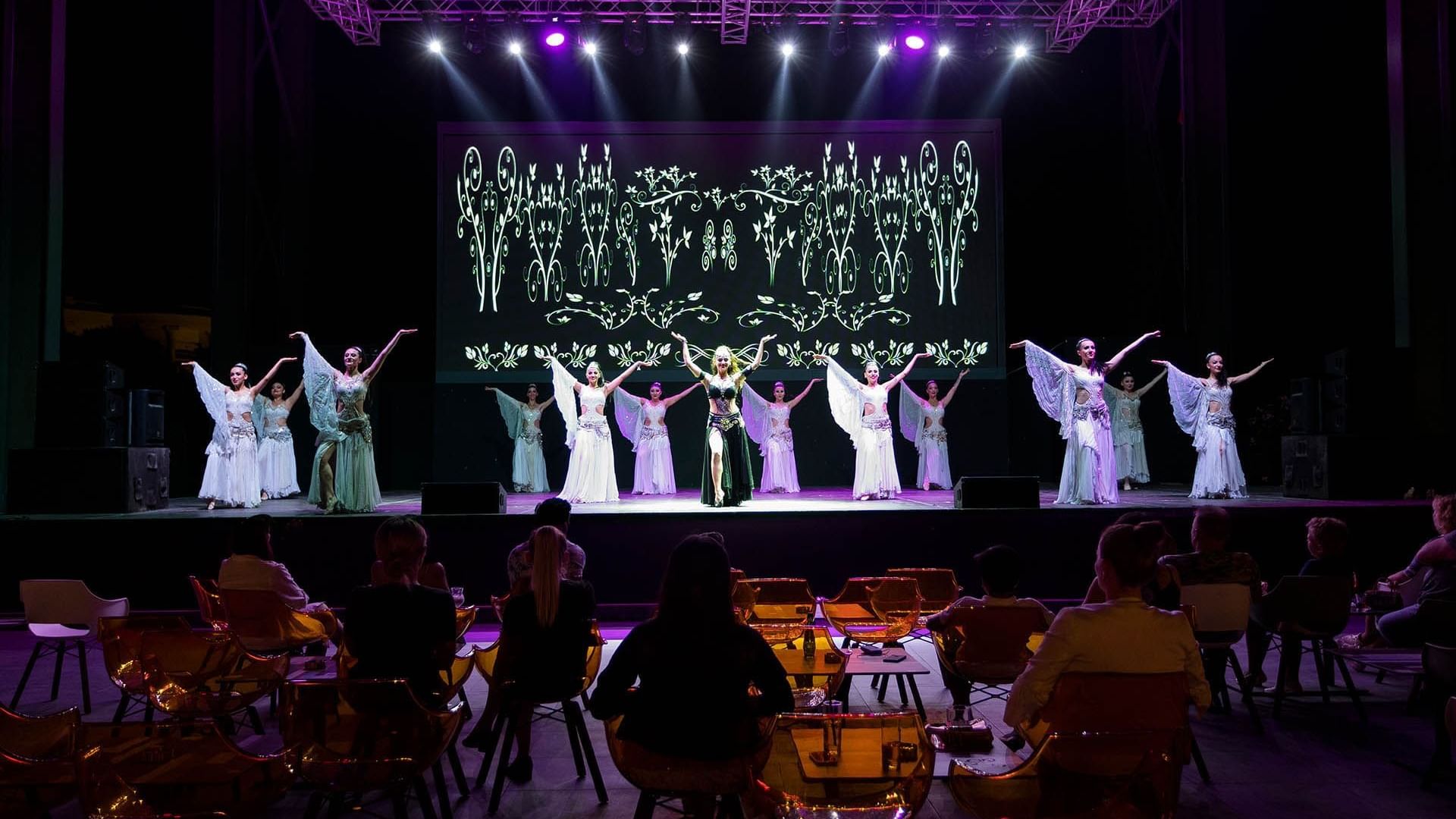 Group of people stands together on stage and present an event in Nevizade Square Bar at Titanic Mardan Palace