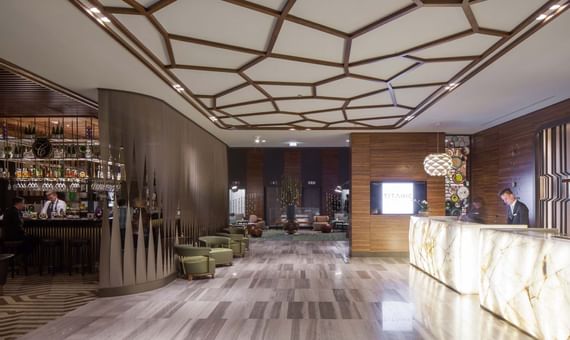 Spacious lobby with front desk counter at Titanic City Taksim