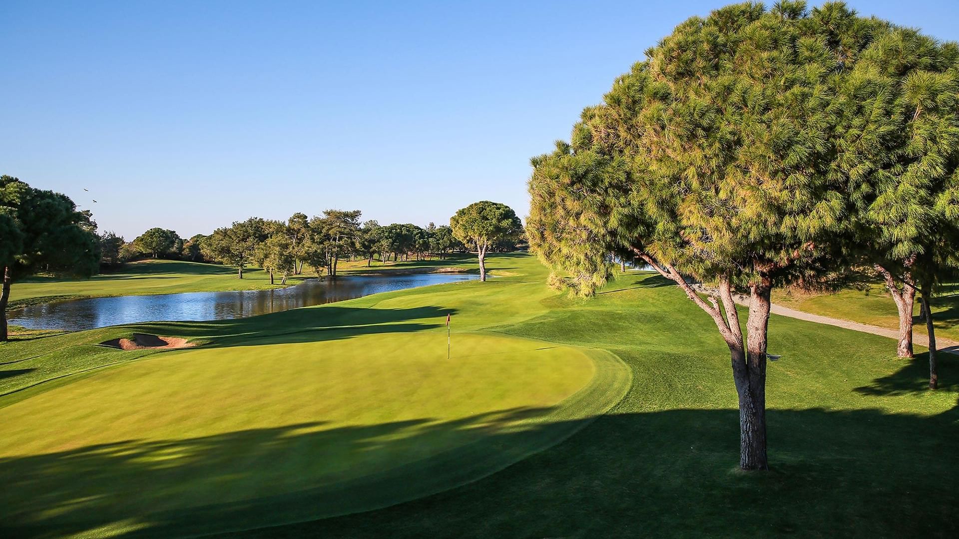 Lush greenery golf course on a sunny day at Titanic Mardan Palace